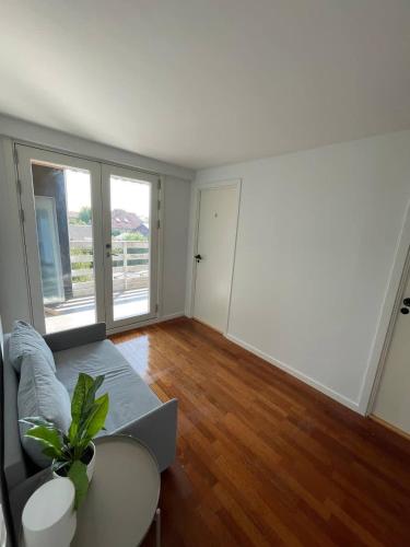 a living room with a couch and a table at Spacious Private House in Amager in Copenhagen