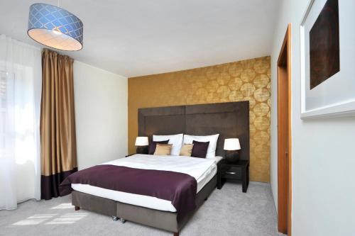 Postel nebo postele na pokoji v ubytování APLEND CITY Hotel Perugia
