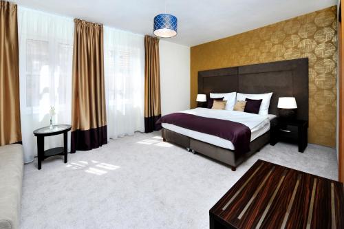 Postel nebo postele na pokoji v ubytování APLEND CITY Hotel Perugia