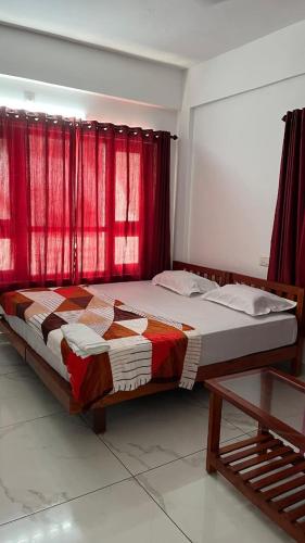 Postel nebo postele na pokoji v ubytování Hotel Paradise Kovalam