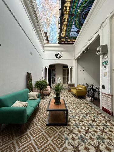 a living room with a couch and a table at Hostel Bohemian in Montevideo