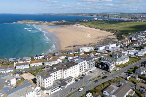 an aerial view of a beach and buildings at 6 The Point, Newquay in Newquay