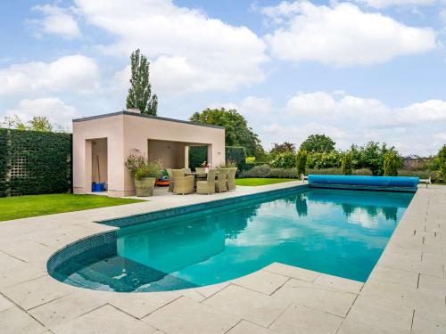 a swimming pool in the backyard of a house at 2 Bed in Goudhurst 51229 in Goudhurst
