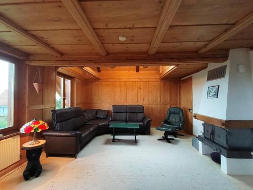 a living room with a couch and a fireplace at Wytblick 