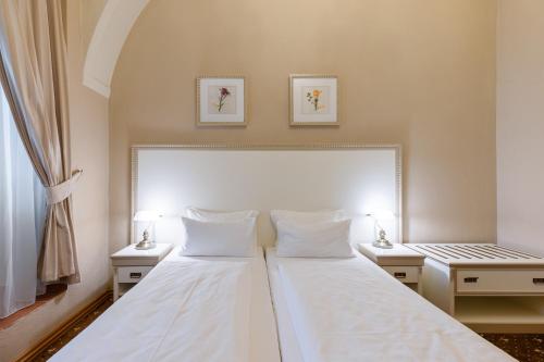 Postel nebo postele na pokoji v ubytování Hotel Gino Park Palace - Kaštieľ Orlové