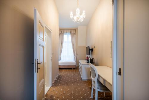 Postel nebo postele na pokoji v ubytování Hotel Gino Park Palace - Kaštieľ Orlové