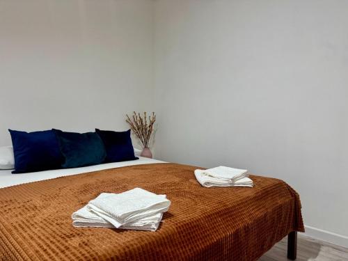 Ένα ή περισσότερα κρεβάτια σε δωμάτιο στο Apartamenty Podlesie