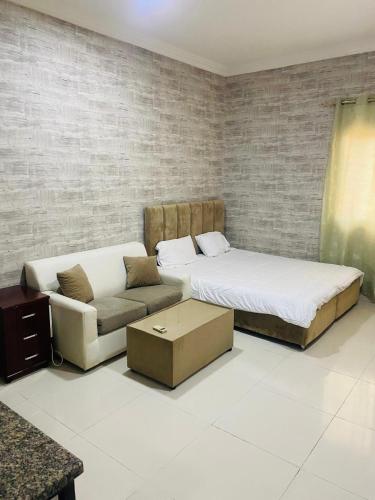 Ένα ή περισσότερα κρεβάτια σε δωμάτιο στο استوديو مفروش