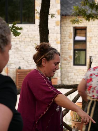 a woman pointing at something while standing next to another woman at Hani i Qerosit in Kuçovë