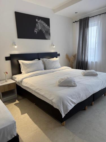 Postel nebo postele na pokoji v ubytování Hotel Sharlota