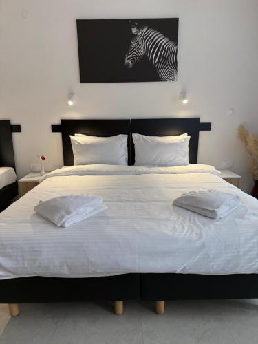Postel nebo postele na pokoji v ubytování Hotel Sharlota