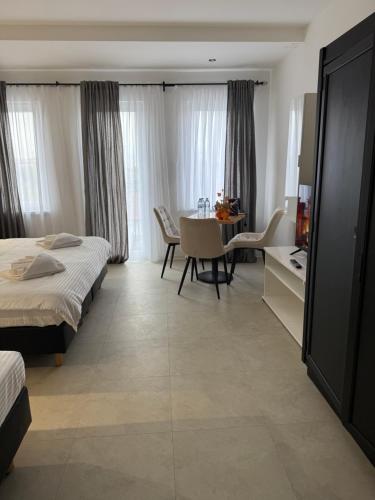 Postel nebo postele na pokoji v ubytování Hotel Sharlota