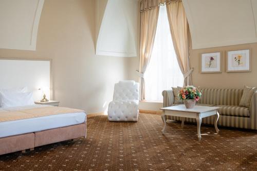 Postel nebo postele na pokoji v ubytování Hotel Gino Park Palace - Kaštieľ Orlové