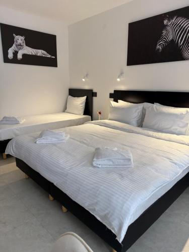 Postel nebo postele na pokoji v ubytování Hotel Sharlota