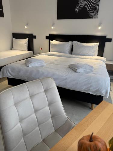 Postel nebo postele na pokoji v ubytování Hotel Sharlota