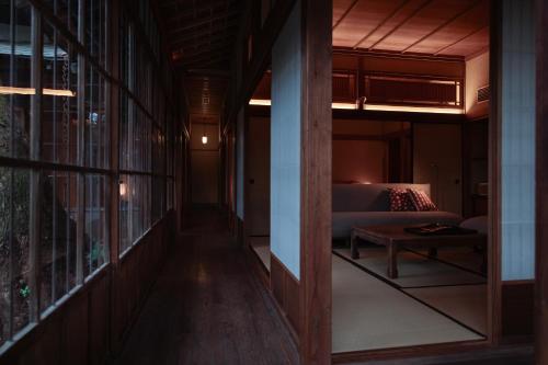 a hallway leading to a living room with a couch at 回青橙 daidai in Atami
