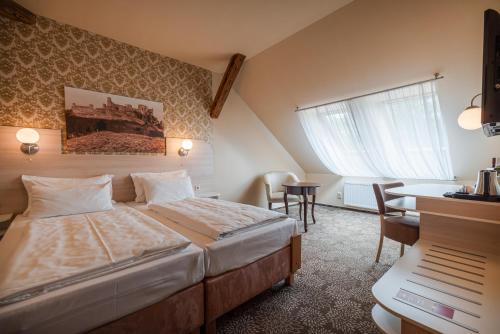 Postel nebo postele na pokoji v ubytování Hotel Gino Park Palace - Kaštieľ Orlové