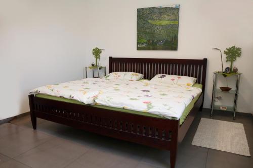 a bed in a room with at Ferienwohnung Im Schiller in Wiesenbronn