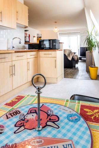 a kitchen with a monkey rug on a table at Beautiful apartment, shops within walking distance, Vannes 5 min in Plescop