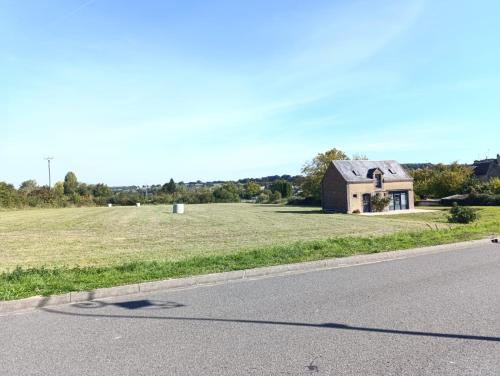 a house sitting on the side of a road at Gîte la prairie in La Chapelle-Huon