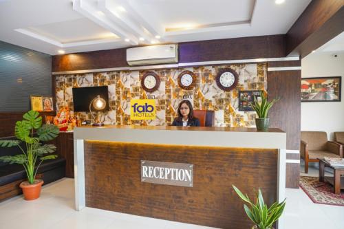 a reception desk in a hotel lobby at FabHotel Jalsa DLX in Bhopal