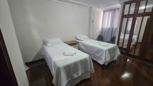 Ein Bett oder Betten in einem Zimmer der Unterkunft Mendes Residence