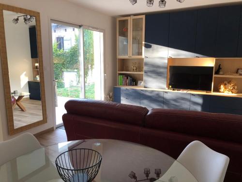 a living room with a couch and a table at Maison d'hôtes à Saix in Saix