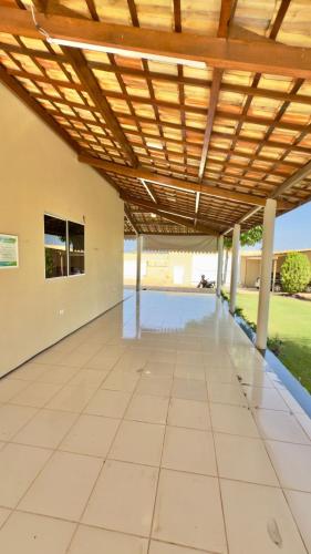 an empty patio with a wooden pergola at VIP eventos in Juazeiro do Norte