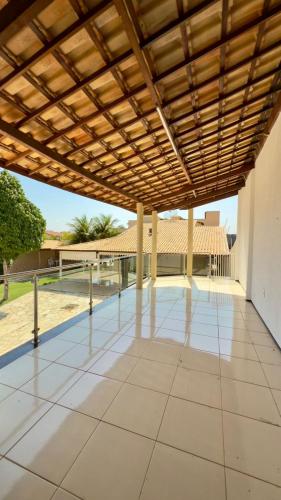 a large patio with a wooden roof over it at VIP eventos in Juazeiro do Norte