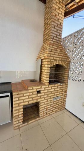 an outdoor brick oven in a room with at VIP eventos in Juazeiro do Norte