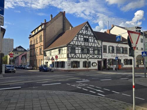 an old building on the corner of a city street at Top-Floor Hideaway for Two in Karlsruhe-Mühlburg - APOLONIAliving - Apt3 in Karlsruhe
