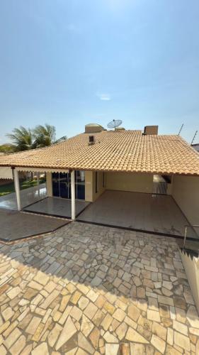 a house with a tile roof and a patio at VIP eventos in Juazeiro do Norte