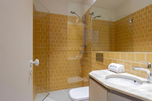 a bathroom with a sink and a shower at Central & Cozy Studio by HostWise in Vila Nova de Gaia
