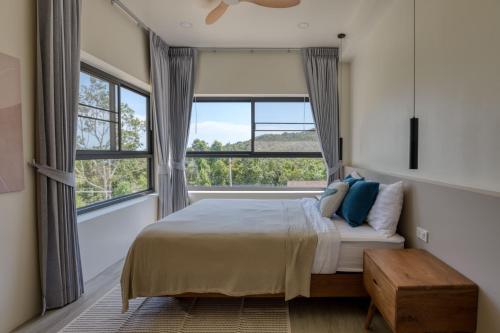 a bedroom with a bed and a large window at New Luxury 4BR Villa with Seaview in Haad Chao Phao