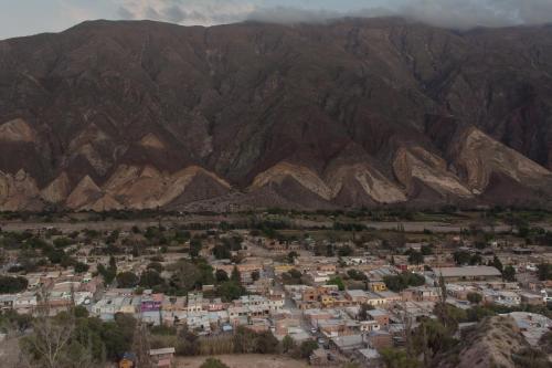 an aerial view of a town in front of mountains at Casa los Molles Hostel in Maimará