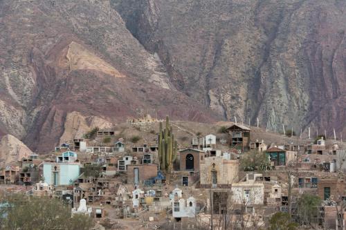 a group of houses in front of a mountain at Casa los Molles Hostel in Maimará