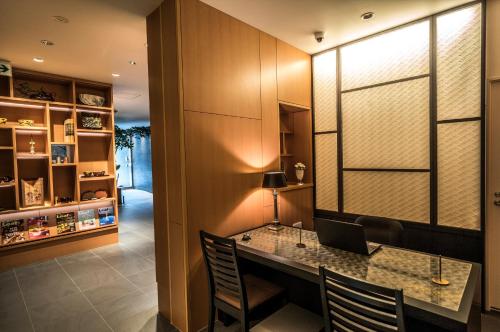 a home office with a desk with a laptop on it at Villa Sanjomuromachi KYOTO in Kyoto