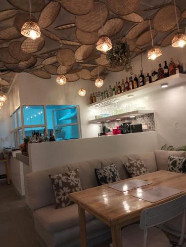 a living room with a couch and a table at Frida Ka in El Nido