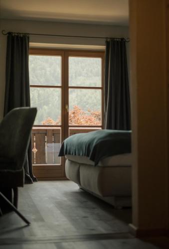 Ένα ή περισσότερα κρεβάτια σε δωμάτιο στο Pension Moarhof