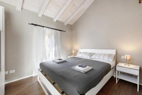 Ένα ή περισσότερα κρεβάτια σε δωμάτιο στο Domas Home appartamento n 3