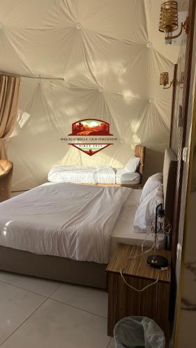 a bedroom with a bed with a tent at Wadi Rum Nebula, Calm Atmosphere in Wadi Rum