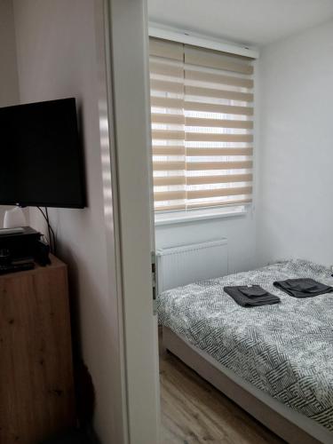 Ένα ή περισσότερα κρεβάτια σε δωμάτιο στο Tri srca