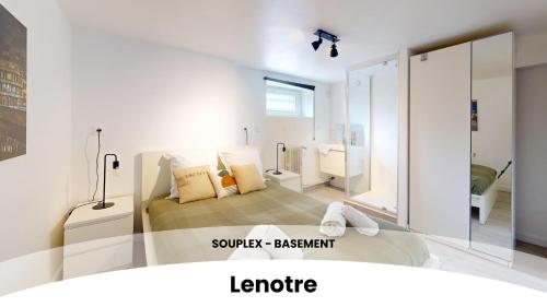 a bedroom with a bed in a room at Les appartements du Général Uhrich - Proche Parlement in Strasbourg