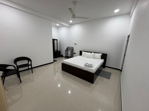 Ένα ή περισσότερα κρεβάτια σε δωμάτιο στο Gala Villa 69 Mirissa