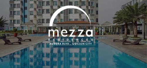 a sign for a hotel in front of a swimming pool at Mezza Residences in Manila