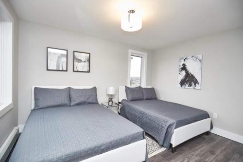 Ένα ή περισσότερα κρεβάτια σε δωμάτιο στο Clifton Boutique 2bd Suite