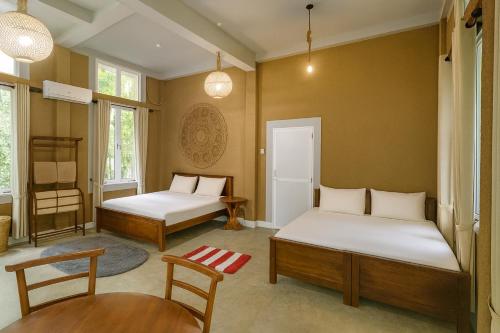 Ένα ή περισσότερα κρεβάτια σε δωμάτιο στο Nature Home near Colombo Airport