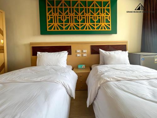 Cama o camas de una habitación en Grand museum & pyramids view inn