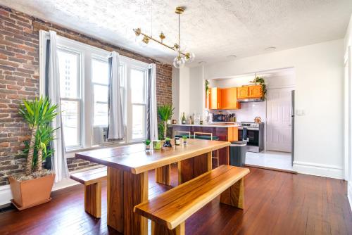 a kitchen with a wooden island in the middle of a room at Prime Location Top Rated Clean Parking Free! in Columbus