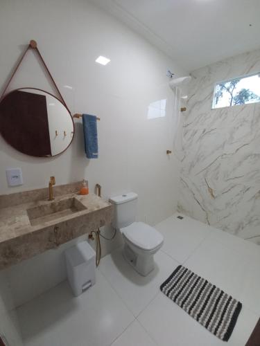 Ένα μπάνιο στο SUÍTE e QUARTO - MASSARANDUPIÓ - RECANTO dos SONHOS